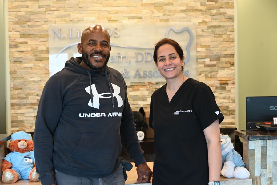 Secure Dental patient smiling after treatment