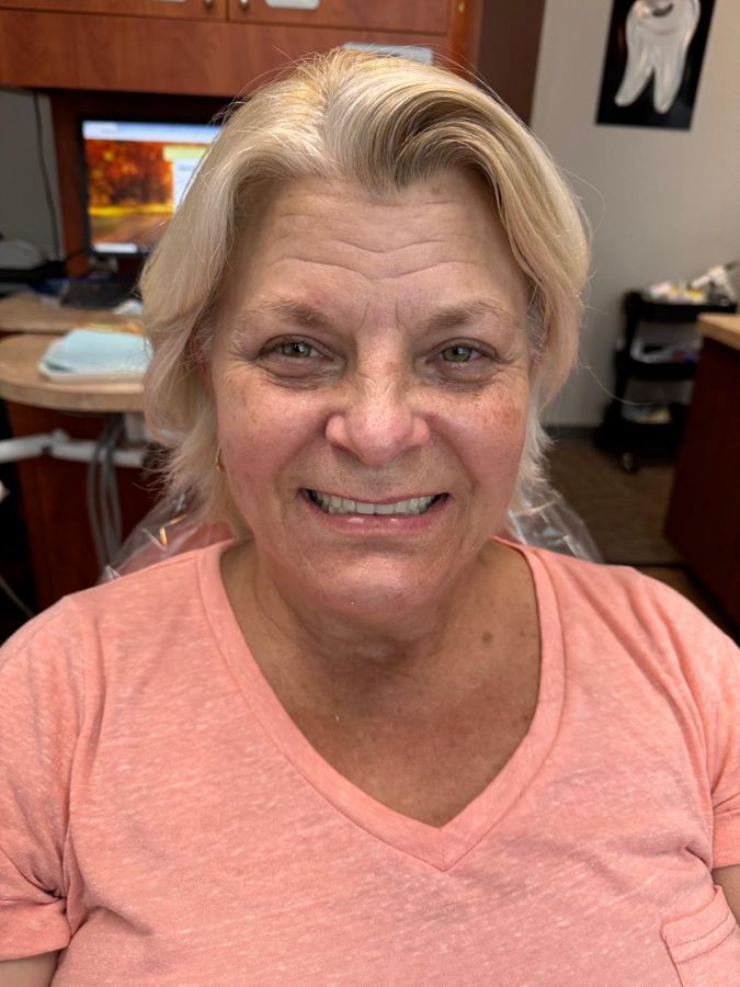 Secure Dental patient smiling after treatment