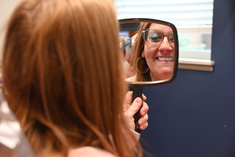 Secure Dental patient smiling after treatment